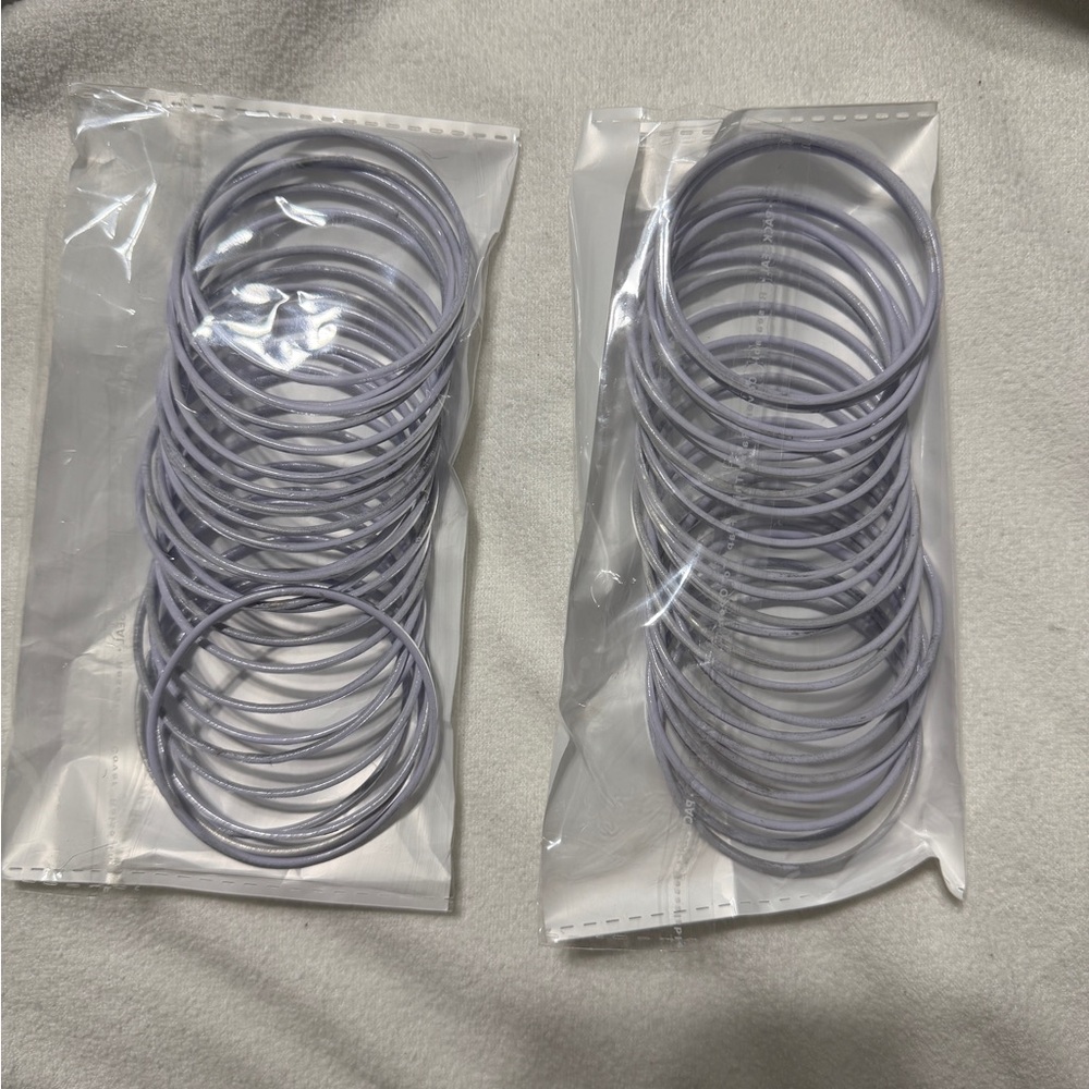 Silver bangles set with lilac lining